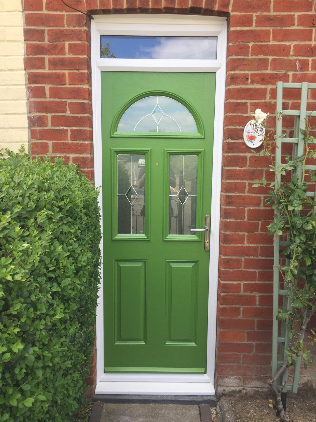 bespoke green narrow front door in RAL paint with white frame