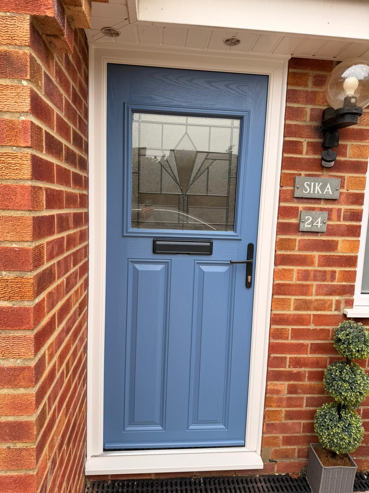 Pigeon Blue Composite Door Hythe a 2 panel 1 square door with black hardware